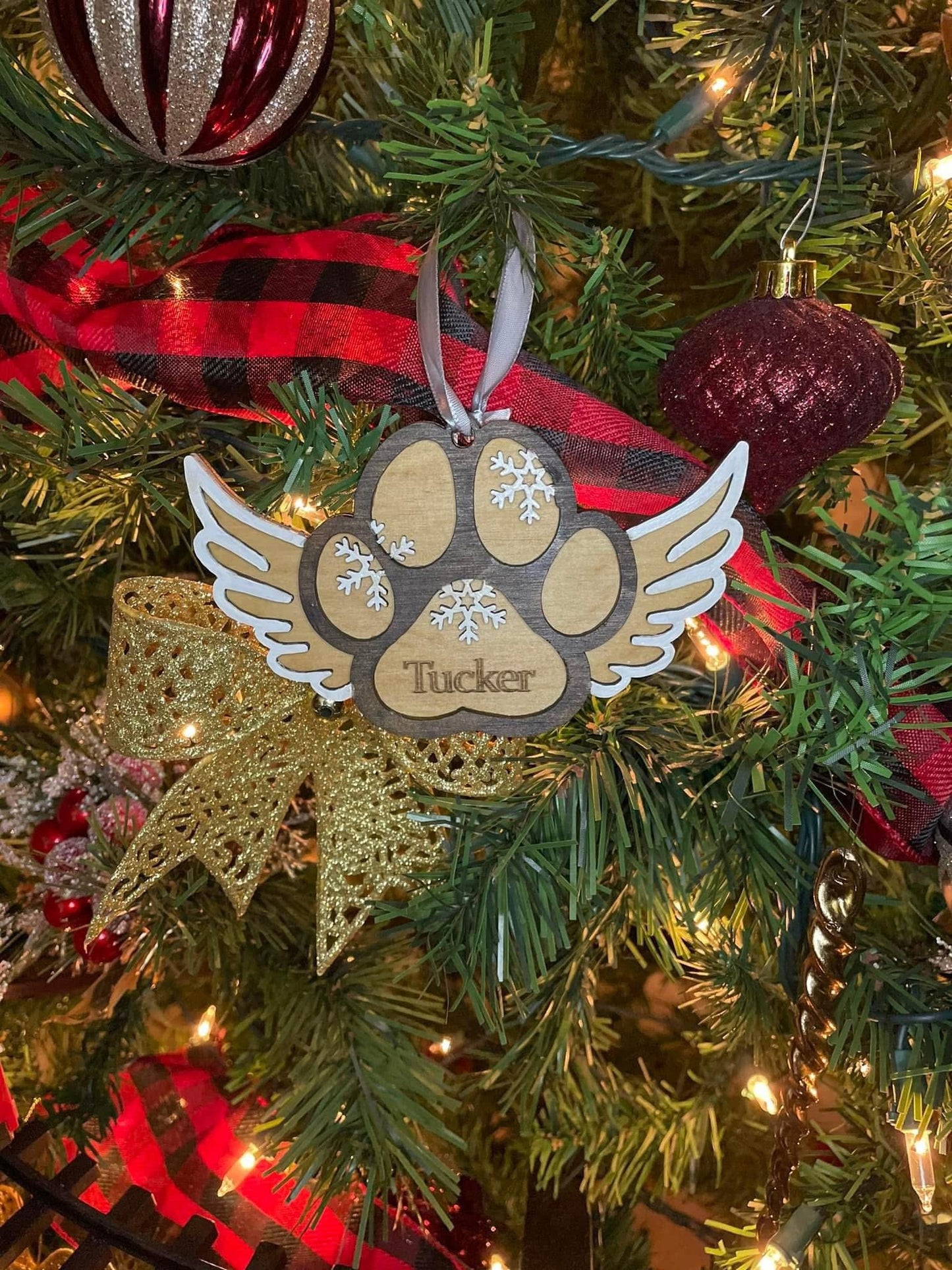 Dog paw print ornament with wings